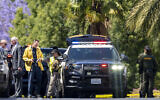 Investigators gather outside the Geneva Presbyterian Church in Laguna Woods, Calif., on Sunday, May 15, 2022 after a fatal shooting. (Leonard Ortiz/The Orange County Register via AP)