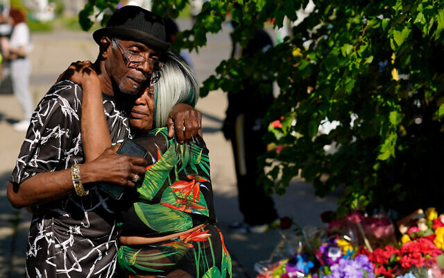People embrace outside the scene of a shooting at a supermarket a day earlier, in Buffalo, N.Y., Sunday, May 15, 2022. (AP Photo/Matt Rourke) People embrace outside the scene of a shooting at a supermarket a day earlier, in Buffalo, N.Y., Sunday, May 15, 2022. (AP Photo/Matt Rourke)