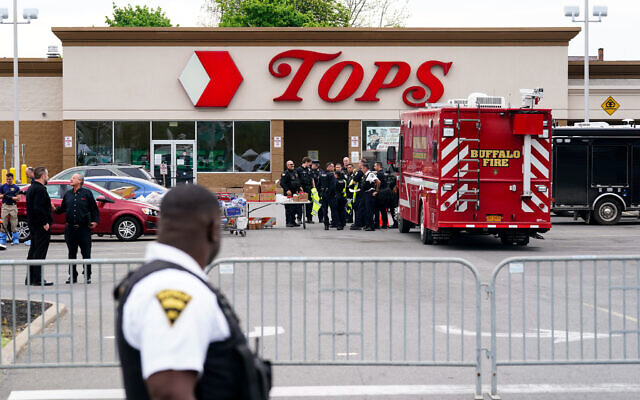 Investigators work the scene of a shooting at a supermarket, in Buffalo, N.Y., Monday, May 16, 2022. (AP Photo/Matt Rourke) Investigators work the scene of a shooting at a supermarket, in Buffalo, N.Y., Monday, May 16, 2022. (AP Photo/Matt Rourke)