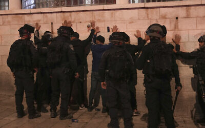 Police detain Palestinians during clashes after the funeral of Walid a-Sharif in East Jerusalem, May 16, 2022 (AP Photo/Mahmoud Illean)