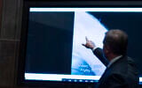 Deputy Director of Naval Intelligence Scott Bray points to a video display of a UAP during a hearing of the House Intelligence, Counterterrorism, Counterintelligence, and Counterproliferation Subcommittee hearing on 'Unidentified Aerial Phenomena,' on Capitol Hill, May 17, 2022, in Washington. (Alex Brandon/AP)