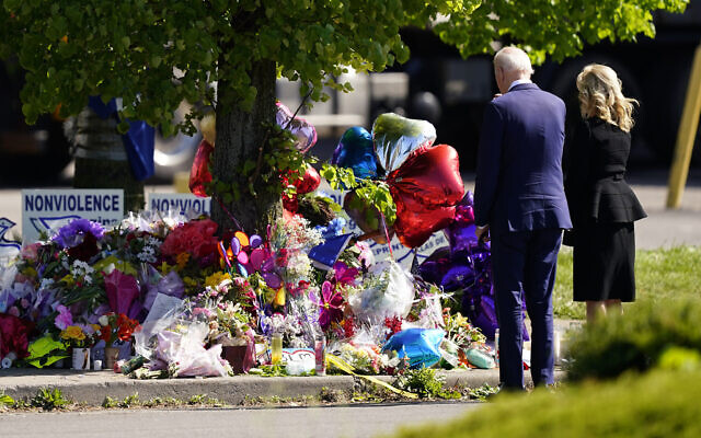 President Joe Biden and first lady Jill Biden visit the scene of a shooting at a supermarket to pay respects and speak to families of the victims of the shooting in Buffalo, New York, May 17, 2022. (Matt Rourke/AP) President Joe Biden and first lady Jill Biden visit the scene of a shooting at a supermarket to pay respects and speak to families of the victims of the shooting in Buffalo, New York, May 17, 2022. (Matt Rourke/AP)