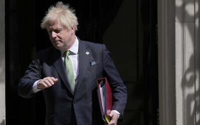 Britain's Prime Minister Boris Johnson leaves 10 Downing Street for the House of Commons for the weekly Prime Minister's Questions In London, May 18, 2022. (AP Photo/Alastair Grant)