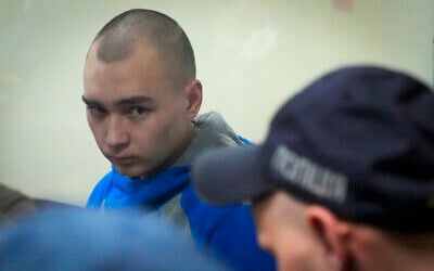 Russian army Sergeant Vadim Shishimarin, 21, is seen behind a glass during a court hearing in Kyiv, Ukraine, May 18, 2022. (AP Photo/Efrem Lukatsky)