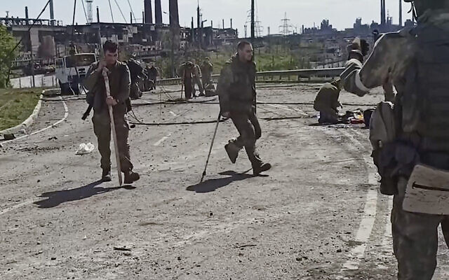 Ukrainian servicemen as they leave the besieged Azovstal steel plant in Mariupol, Ukraine, on May 18, 2022. (from a video released by Russian Defense Ministry Press Service via AP) Ukrainian servicemen as they leave the besieged Azovstal steel plant in Mariupol, Ukraine, on May 18, 2022. (from a video released by Russian Defense Ministry Press Service via AP)