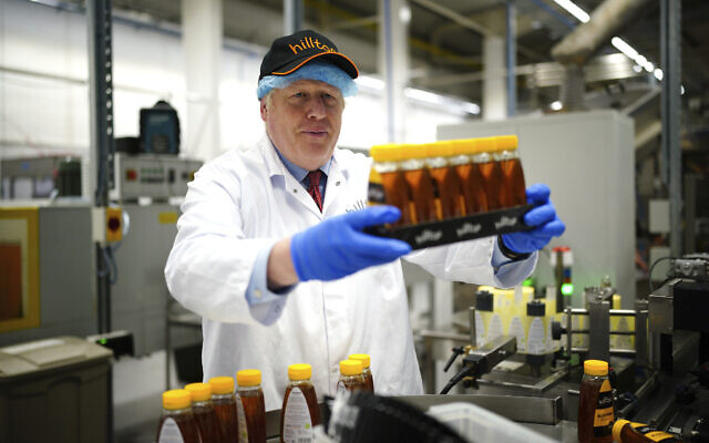 British Prime Minister Boris Johnson during a visit to Hilltop Honey in Newtown, Powys, Wales, May 20, 2022. (Ben Birchall/Pool via AP) British Prime Minister Boris Johnson during a visit to Hilltop Honey in Newtown, Powys, Wales, May 20, 2022. (Ben Birchall/Pool via AP)