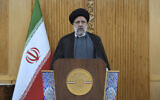 Iranian President Ebrahim Raisi speaks before departing Tehran's Mehrabad airport for a trip to Oman, May, 23, 2022. (AP Photo/Vahid Salemi)