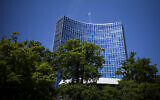 The United Nations flag waves in the wind on the top of a UN building in Geneva, Switzerland, June 14, 2021. (AP Photo/Markus Schreiber)