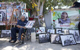Palestinian journalist Ali Al Samoudi visits a makeshift shrine at the site where veteran Palestinian-American Al Jazeera journalist Shireen Abu Akleh was killed during clashes between IDF troops and Palestinian gunmen while covering an IDF raid in Jenin, May 19, 2022. (AP/Majdi Mohammed)