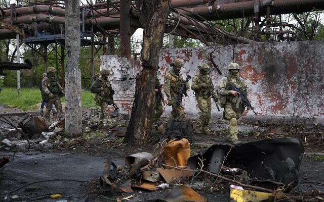 Russian troops walk in a destroyed part of the Illich Iron & Steel Works Metallurgical Plant in Mariupol, in territory under the government of the Donetsk People's Republic, eastern Ukraine, May 18, 2022. (AP Photo, File) Russian troops walk in a destroyed part of the Illich Iron & Steel Works Metallurgical Plant in Mariupol, in territory under the government of the Donetsk People's Republic, eastern Ukraine, May 18, 2022. (AP Photo, File)