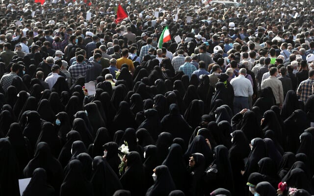 Mourners attend the funeral ceremony of Iran's Revolutionary Guard Col. Hassan Sayyad Khodaei in Tehran, Iran, May 24, 2022. (AP Photo/Vahid Salemi)