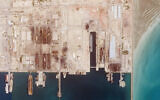 This satellite photo from Planet Labs PBC shows the Iranian Revolutionary Guard's newest ship, the Shahid Mahdavi, center right, under construction in a shipyard west of Bandar Abbas, Iran, May 21, 2022. (Planet Labs PBC via AP)