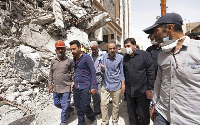 Iranian Senior Vice-President Mohammad Mokhber (second right) visits the 10-story Metropol Building which collapsed on Monday, in the city of Abadan, Iran, May 27, 2022. (Iranian Senior Vice-President Office via AP) Iranian Senior Vice-President Mohammad Mokhber (second right) visits the 10-story Metropol Building which collapsed on Monday, in the city of Abadan, Iran, May 27, 2022. (Iranian Senior Vice-President Office via AP)