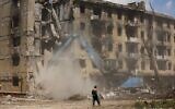 Russian Emergency Situations Ministry workers disassemble a destroyed building in Mariupol, in territory under the government of the Donetsk People's Republic, eastern Ukraine, May 27, 2022. (AP Photo/Alexei Alexandrov)