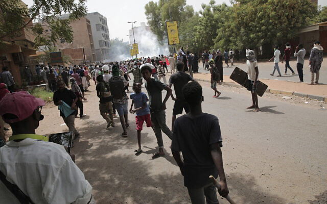 Protesters clash with security forces as they fire teargas to prevent them from marching towards the presidential palace during demonstrations demanding civilian rule, in Khartoum, Sudan, May 19, 2022. (AP Photo/Marwan Ali, File) Protesters clash with security forces as they fire teargas to prevent them from marching towards the presidential palace during demonstrations demanding civilian rule, in Khartoum, Sudan, May 19, 2022. (AP Photo/Marwan Ali, File)