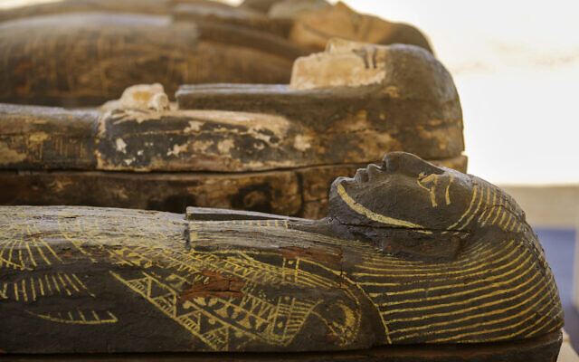 Painted coffins with well-preserved mummies inside, dating back to the Late Period of ancient Egypt around 500 B.C, are displayed at a makeshift exhibit at the feet of the Step Pyramid of Djoser in Saqqara, 24 kilometers (15 miles) southwest of Cairo, Egypt, May 30, 2022. (AP Photo/Amr Nabil) Painted coffins with well-preserved mummies inside, dating back to the Late Period of ancient Egypt around 500 B.C, are displayed at a makeshift exhibit at the feet of the Step Pyramid of Djoser in Saqqara, 24 kilometers (15 miles) southwest of Cairo, Egypt, May 30, 2022. (AP Photo/Amr Nabil)