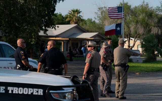 Law enforcement personnel stand outside a funeral home during a visitation for Amerie Garza, a 10-year-old victim who was killed in last week's elementary school shooting in Uvalde, Texas, Monday, May 30, 2022. (AP Photo/Jae C. Hong) Law enforcement personnel stand outside a funeral home during a visitation for Amerie Garza, a 10-year-old victim who was killed in last week's elementary school shooting in Uvalde, Texas, Monday, May 30, 2022. (AP Photo/Jae C. Hong)