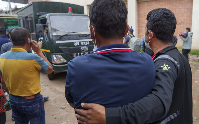 Relatives mourn as a vehicle carrying the bodies of victims of a plane crash arrive at a hospital in Kathmandu, Nepal, May 31, 2022. (AP Photo/Niranjan Shrestha) Relatives mourn as a vehicle carrying the bodies of victims of a plane crash arrive at a hospital in Kathmandu, Nepal, May 31, 2022. (AP Photo/Niranjan Shrestha)
