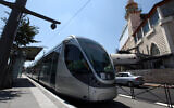 An illustrative photo of the Jerusalem light rail passing through Shuafat. (Kobi Gideon/Flash90)
