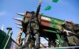 File: Members of Al-Qassam Brigades, the armed wing of the Hamas terror group, attend a rally in Beit Lahiya, May 30, 2021. (Atia Mohammed/Flash90)