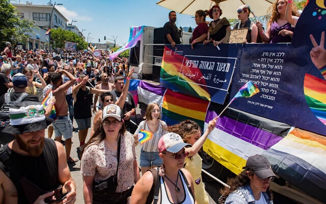 People march during the annual Pride Parade in Haifa, June 18, 2021. (Roni Ofer/Flash90) People march during the annual Pride Parade in Haifa, June 18, 2021. (Roni Ofer/Flash90)