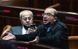 Joint List MKs Sami Abou Shahadeh (right) and Ahmad Tibi seen during a plenum session at the Knesset on February 23, 2022. (Yonatan Sindel/Flash90)