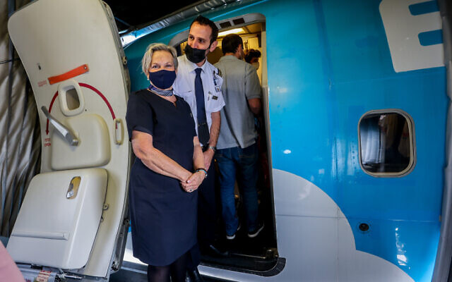 Crew members wearing masks stand at the door for the first direct flight between Tel Aviv and Egypt's Red Sea resort of Sharm el-Sheikh, at Ben Gurion Airport, near Tel Aviv, on April 17, 2022. (Flash90) Crew members wearing masks stand at the door for the first direct flight between Tel Aviv and Egypt's Red Sea resort of Sharm el-Sheikh, at Ben Gurion Airport, near Tel Aviv, on April 17, 2022. (Flash90)