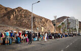 Travelers cross through the Taba border crossing during the Jewish holiday of Passover in the southern Israeli city of Eilat, April 17, 2022. (Flash90)