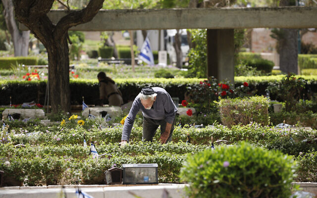 A man visits a grave of a loved one at the military cemetery in Haifa, May 3, 2022. (Shir Torem/Flash90) A man visits a grave of a loved one at the military cemetery in Haifa, May 3, 2022. (Shir Torem/Flash90)