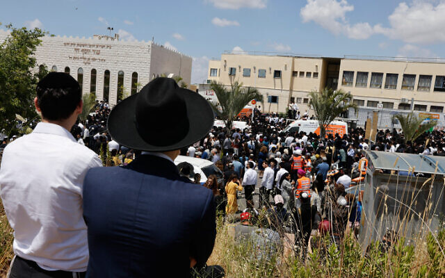 Ultra-Orthodox Jews attend funeral service in Elad for Yonatan Havakuk and Boaz Gol, killed the night before in a terrorist ax attack, on May 6, 2022. (Olivier Fitoussi/Flash90) Ultra-Orthodox Jews attend funeral service in Elad for Yonatan Havakuk and Boaz Gol, killed the night before in a terrorist ax attack, on May 6, 2022. (Olivier Fitoussi/Flash90)