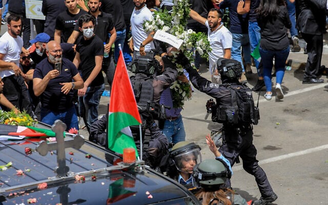 Israel police at the funeral procession of Al Jazeera journalist Shireen Abu Aqleh at St Joseph hospital in Jerusalem, May 13, 2022. (Jamal Awadl/Flash90) Israel police at the funeral procession of Al Jazeera journalist Shireen Abu Aqleh at St Joseph hospital in Jerusalem, May 13, 2022. (Jamal Awadl/Flash90)
