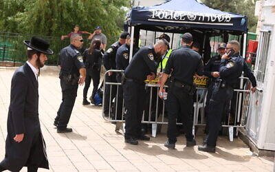 Police officers guard ahead of the Lag B'omer festival, at the Tomb of Rabbi Shimon bar Yochai, in Meron, northern Israel on May 15, 2022. (David Cohen/Flash90)