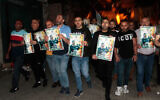 Palestinians carry pictures of Daoud Al-Zubaidi during a protest in the West Bank city of Jenin, May 15, 2022. (Nasser Ishtayeh/Flash90)