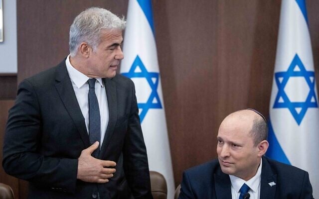 Prime Minister Naftali Bennett, right, and Foreign Minister Yair Lapid at a cabinet meeting at the Prime Minister's Office in Jerusalem on May 15, 2022 (Courtesy Yonatan Sindel/Flash90) Prime Minister Naftali Bennett, right, and Foreign Minister Yair Lapid at a cabinet meeting at the Prime Minister's Office in Jerusalem on May 15, 2022 (Courtesy Yonatan Sindel/Flash90)