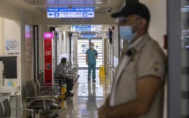 A security guard is seen at Hadassah Mount Scopus Hospital, as medical teams go on 24-hour strike in protest of recent attacks on hospital medical staff, May 19, 2022. (Olivier Fitoussi/Flash90) A security guard is seen at Hadassah Mount Scopus Hospital, as medical teams go on 24-hour strike in protest of recent attacks on hospital medical staff, May 19, 2022. (Olivier Fitoussi/Flash90)