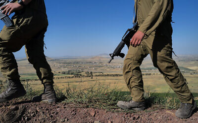 Illustrative: IDF soldiers at a military outpost overlooking Syria in the southern Golan Heights on May 23, 2022. (Michael Giladi/Flash90)
