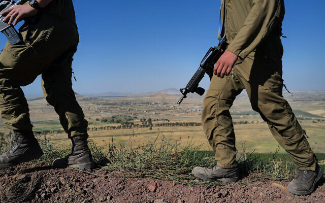 Illustrative: IDF soldiers at a military outpost overlooking Syria in the southern Golan Heights on May 23, 2022. (Michael Giladi/Flash90) Illustrative: IDF soldiers at a military outpost overlooking Syria in the southern Golan Heights on May 23, 2022. (Michael Giladi/Flash90)