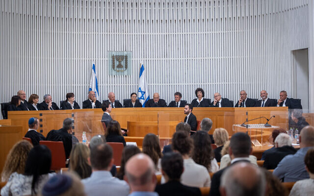 Supreme Court Chief Justice Ester Hayut with outgoing Supreme Court judge George Karra and Supreme court justices at a ceremony held for Karra, at the Supreme Court in Jerusalem on May 29, 2022. (Yonatan Sindel/Flash90) Supreme Court Chief Justice Ester Hayut with outgoing Supreme Court judge George Karra and Supreme court justices at a ceremony held for Karra, at the Supreme Court in Jerusalem on May 29, 2022. (Yonatan Sindel/Flash90)