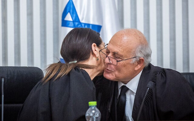 Supreme Court Chief Justice Ester Hayut with outgoing Supreme Court judge George Kara, at the Supreme Court in Jerusalem on May 29, 2022. (Yonatan Sindel/Flash90) Supreme Court Chief Justice Ester Hayut with outgoing Supreme Court judge George Kara, at the Supreme Court in Jerusalem on May 29, 2022. (Yonatan Sindel/Flash90)