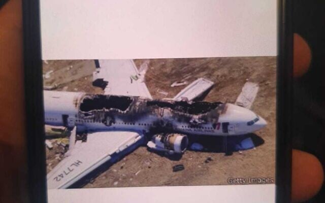 A photo of Asiana Airlines Flight 214, one of several plane crash photos sent to passengers on a flight from Israel to Turkey that was delayed on May 10, 2022 (Israel Airports Authority) A photo of Asiana Airlines Flight 214, one of several plane crash photos sent to passengers on a flight from Israel to Turkey that was delayed on May 10, 2022 (Israel Airports Authority)