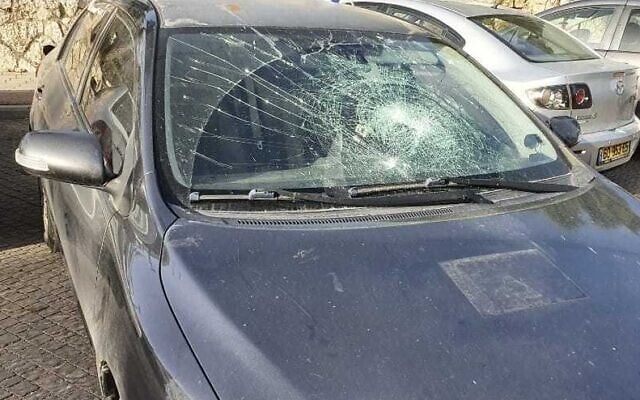 The smashed front window of an Israeli car after a Palestinian allegedly hurled a cinderblock at the vehicle near the West Bank settlement of Beit El, May 13, 2022. (Courtesy) The smashed front window of an Israeli car after a Palestinian allegedly hurled a cinderblock at the vehicle near the West Bank settlement of Beit El, May 13, 2022. (Courtesy)