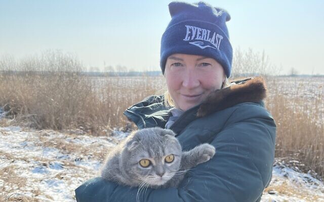 A civilian traveling with her pet as part of  the rescue convoy from Yaroslavka, Ukraine, March 20, 2022. (Klara Lisinski/ Dorcas Kauffman)