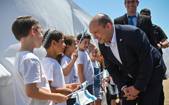 Prime Minister Naftali Bennett meets with children in the West Bank settlement of Elkana on May 17, 2022. (Kobi Gideon / GPO) Prime Minister Naftali Bennett meets with children in the West Bank settlement of Elkana on May 17, 2022. (Kobi Gideon / GPO)