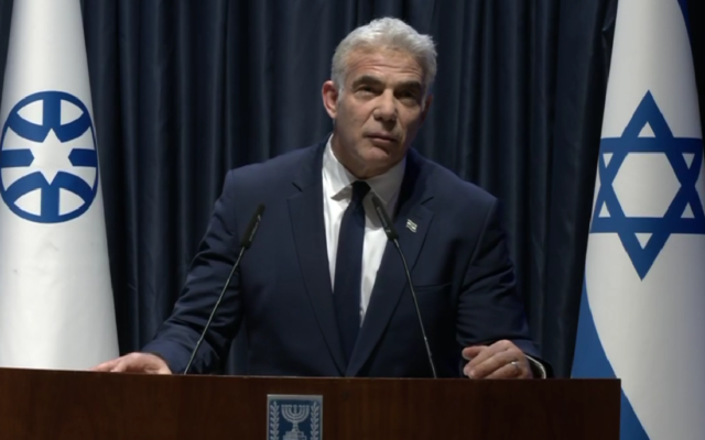 Foreign Minister Yair Lapid speaks during a ceremony honoring staff of the "Shining Star" field hospital that Israel operated in western Ukraine, May 29, 2022. (Screen capture: GPO) Foreign Minister Yair Lapid speaks during a ceremony honoring staff of the "Shining Star" field hospital that Israel operated in western Ukraine, May 29, 2022. (Screen capture: GPO)