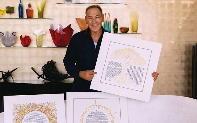 Celebrity designer Neil Lane holds a ketubah. (Authentic Brands Group/ via JTA)