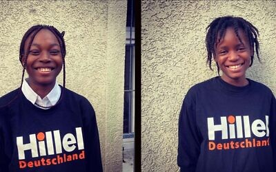 Nigerian students Funke Oluwatosin, left, and Deborah Ologbenla, right, pose for photos in Hillel sweatshirts. (Courtesy of Rabbi Jeremy Borovitz via JTA)