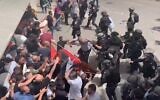 Shireen Abu Akleh's casket almost hits the ground outside Saint Joseph’s Hospital in Jerusalem, May 13, 2022 (Screenshot / Washington Post)
