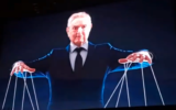 An image depicting Jewish philanthropist George Soros as a puppet master, from a campaign video for Kim Crockett, Minnesota GOP candidate for Secretary of State. (Screen capture via JTA)