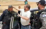 Then-Joint List Knesset member Ofer Cassif appears to hit a police officer in the West Bank on May 13, 2022. (Screenshot)