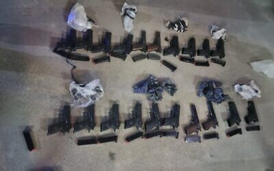 Weapons seized by police officers near Tel Arad in southern Israel, after an alleged gun-smuggling over the border with Jordan on May 2, 2022. (Israel Police)